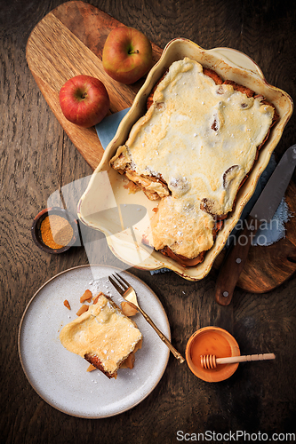 Image of Homemade bread pudding breakfast casserole with apples and cinnamon