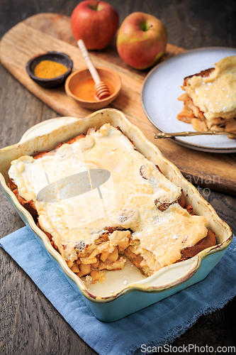 Image of Homemade bread pudding breakfast casserole with apples and cinnamon