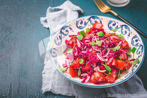 Image of Winter salad - pickled red cabage salad with radish, tomatoes, onion and  winter purslane