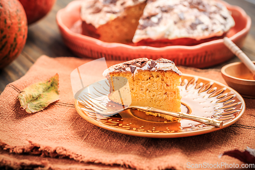 Image of Homemade pumpkin cake with apples and fresh cheese icing