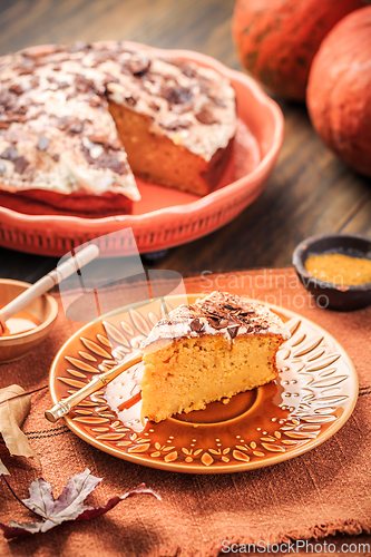 Image of Homemade pumpkin cake with apples and fresh cheese icing