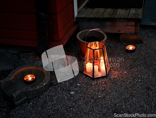 Image of outdoor Christmas candles at the doorstep of a Finnish house