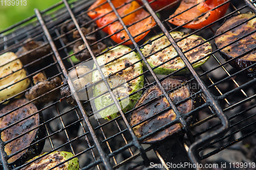 Image of vegetables char-grilled over flame