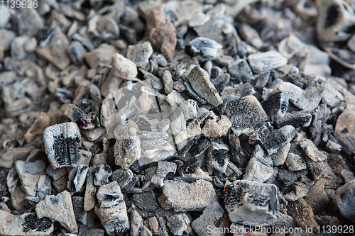 Image of black coals in the fireplace