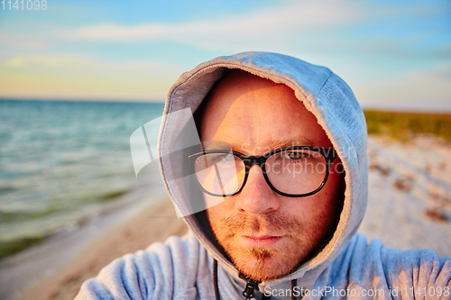 Image of Handsome man making selfie 