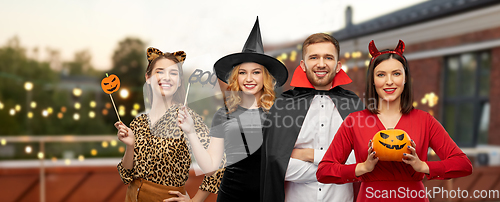 Image of friends in halloween costumes at roof top party