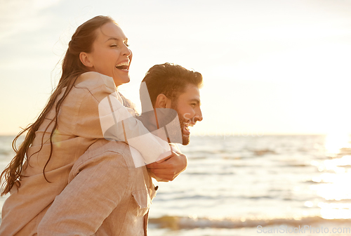 Image of happy couple having fun on summer beach