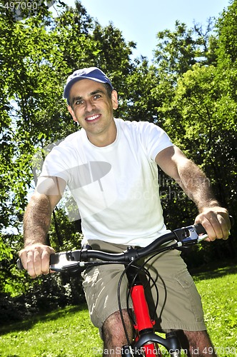 Image of Man riding a bicycle