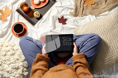 Image of woman with tablet pc at home in autumn