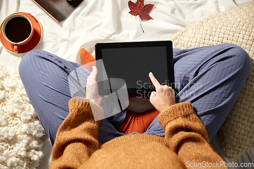 Image of woman with tablet pc at home in autumn