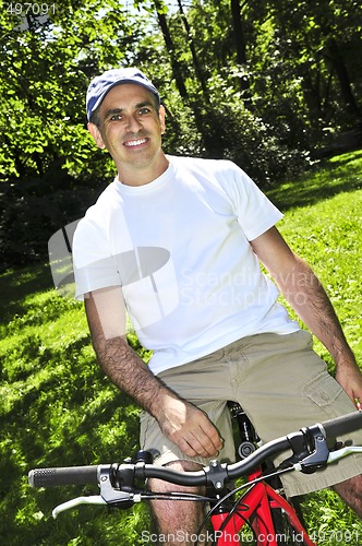 Image of Man riding a bicycle