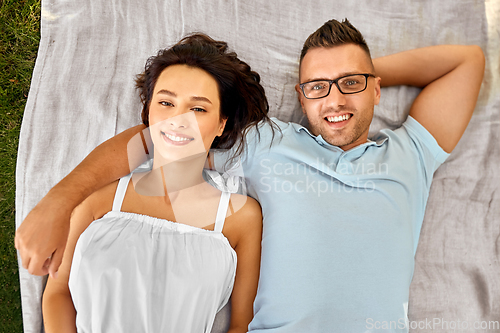 Image of happy couple on picnic blanket