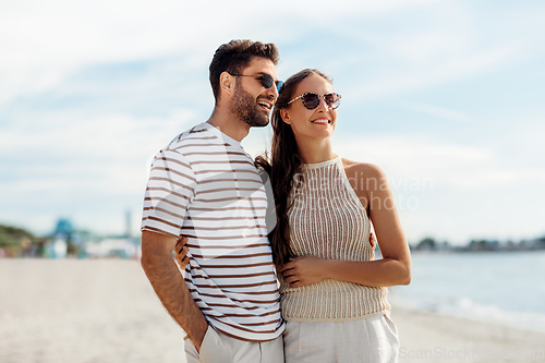 Image of happy couple on summer beach