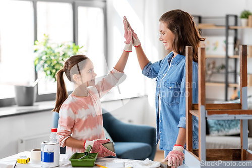 Image of mother and daughter making high five gesture