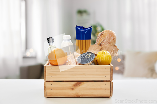 Image of food in wooden box on table at home