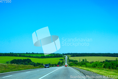 Image of asphalted road and the blue sky