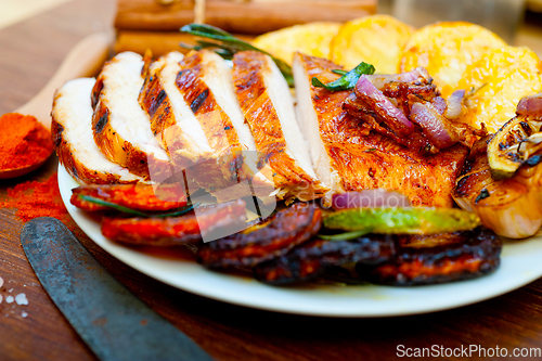 Image of roasted grilled BBQ chicken breast with herbs and spices