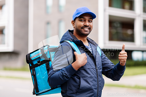 Image of indian delivery man with bag showing thumbs up