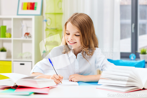 Image of student girl with books learning at home