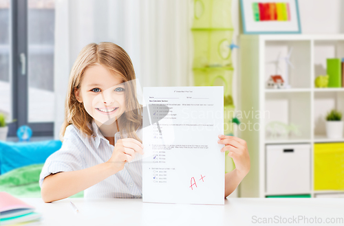 Image of student girl with school test and A grade at home