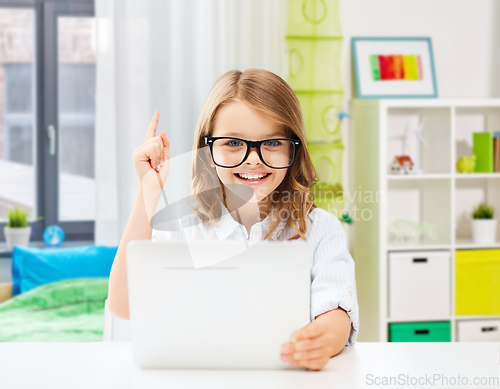 Image of student girl in glasses with tablet pc at home