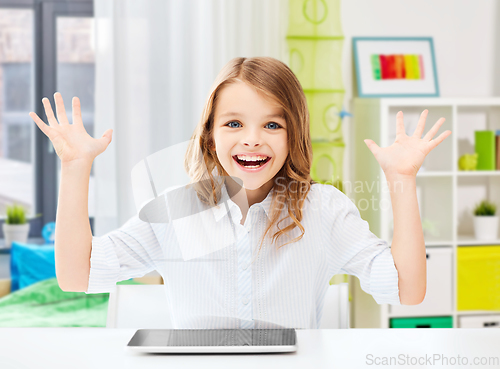 Image of happy laughing student girl with tablet pc at home