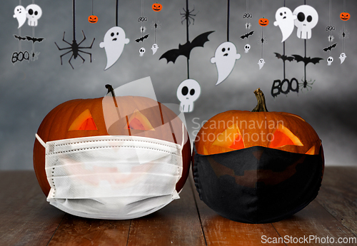 Image of carved pumpkins or jack-o-lanterns in masks