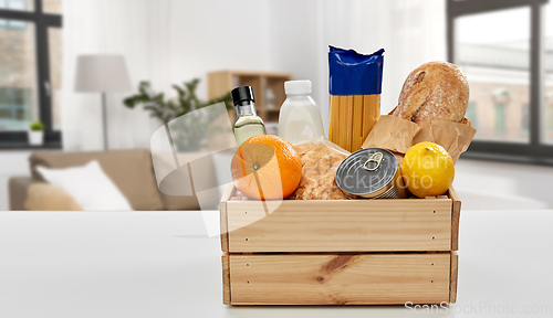 Image of food in wooden box on table at home