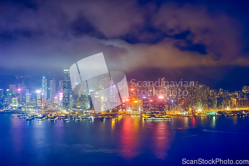 Image of Aerial view of illuminated Hong Kong skyline. Hong Kong, China