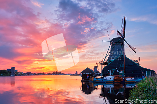 Image of Windmills at Zaanse Schans in Holland on sunset. Zaandam, Nether