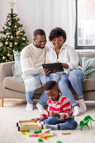 Image of happy african american family on christmas at home