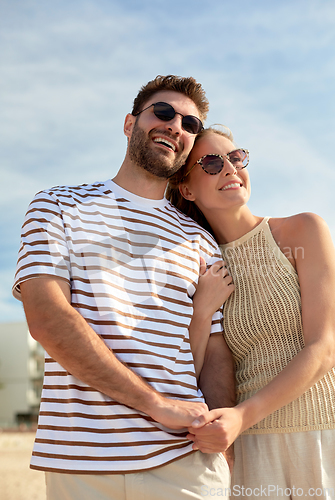Image of happy couple on summer beach