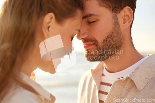 Image of happy couple with closed eyes on summer beach