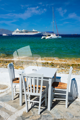 Image of Catamaran yacht and cruise liner is Aegean sea. Chora, Mykonos island, Greece