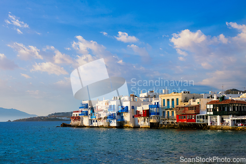 Image of Sunset in Mykonos, Greece, with cruise ship and yachts in the harbor