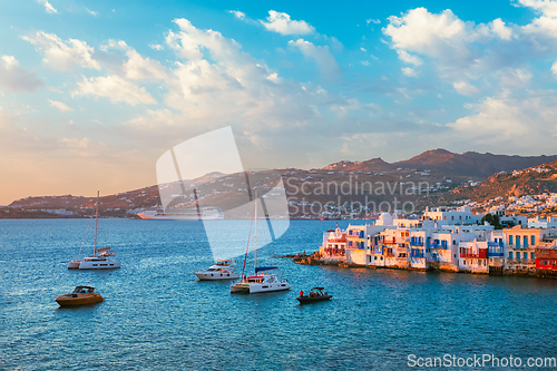 Image of Sunset in Mykonos, Greece, with cruise ship and yachts in the harbor