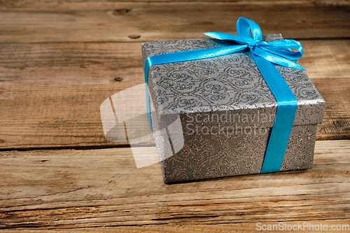 Image of Gift box with blue ribbon