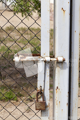 Image of metal gates and a fence