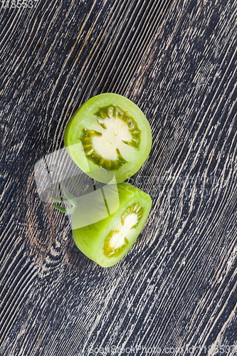 Image of cut one green tomato