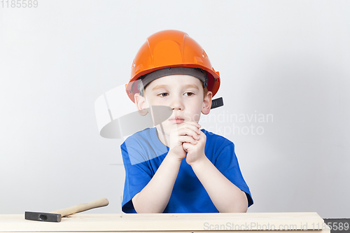 Image of thoughtful boy in a helmet