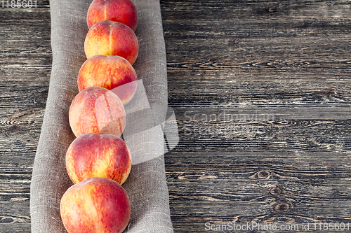 Image of row ripe orange peaches