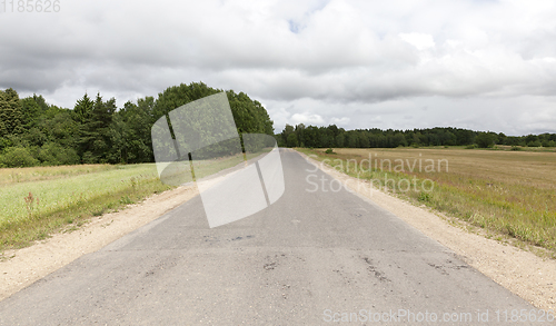 Image of old dusty paved road