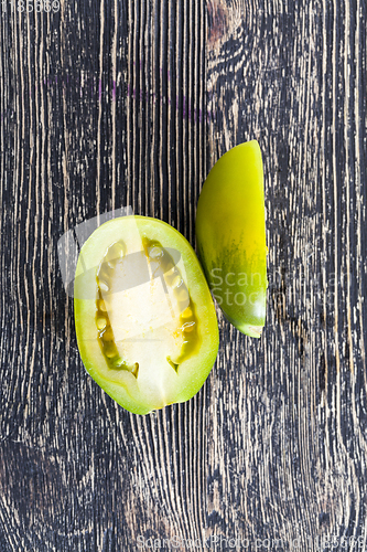 Image of cut one green tomato