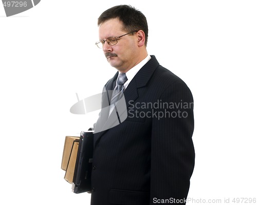 Image of Businessman with laptop and books