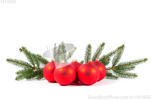 Image of red Christmas balls and fir branch