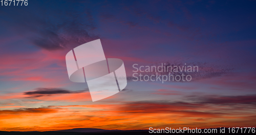 Image of very colorful red, blue, orange and violet late sunset