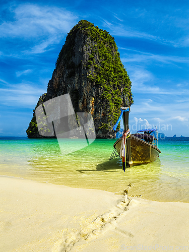 Image of Long tail boat on beach, Thailand