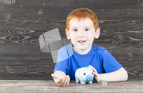 Image of the boy with piggy bank