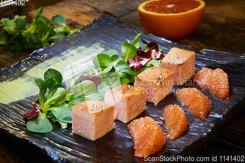 Image of Slow Cooked Salmon fillet steak with salad on plate, Sous-Vide Cooking Salmon Fish