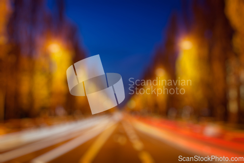 Image of Blurred background of street road in evening